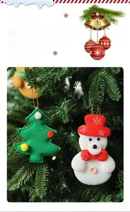 Handmade felt Christmas ornaments with snowman bear and festive tree hanging on branches