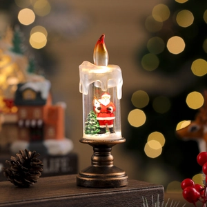 Close-up of Santa Claus inside a retro LED candle with a warm festive bokeh background