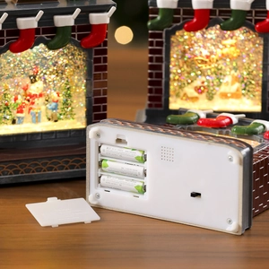 Christmas fireplace snow globe lantern with snowman and tree inside for festive decor