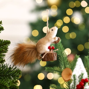 Detailed view of squirrel Christmas ornament with pine cone and berries on a wooden base