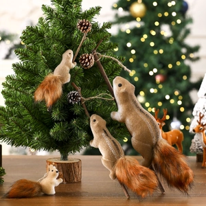 Lifelike Christmas squirrel ornaments with fluffy tails on a warm festive tree background