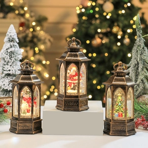 Vintage bronze Christmas lanterns with Santa, Snowman and Tree featuring warm LED lights