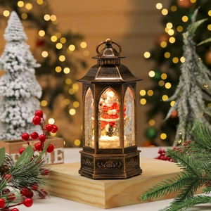 Detail of vintage Christmas lantern with LED snow globe scene and Father Christmas inside