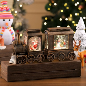 Detail of vintage Christmas train ornament featuring Santa, snowmen, and glowing lights