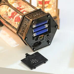 Bottom view of Christmas lantern showing battery compartment and dual-mode music switch