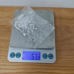Detailed view of 57.3g weight measurement for clear acrylic snowflake tree ornaments