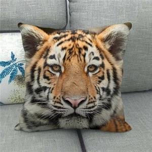 Close-up of realistic tiger face printed on a high-quality linen cushion cover