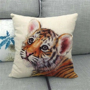 Linen decorative pillow cover featuring a realistic tiger face print on a grey sofa