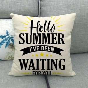 Linen summer cushion cover with Hello Summer text and sun motif on a gray sofa
