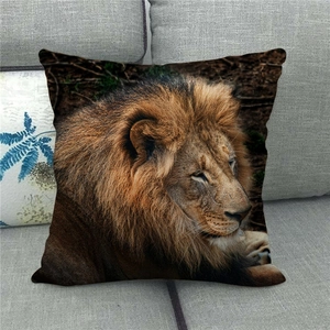 Detailed realistic lion head print on linen throw pillow case on a grey sofa