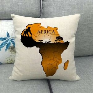 Detail of linen pillowcase with watercolor Africa map and wildlife on gray sofa