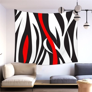 Détail d'une tapisserie moderne avec des motifs abstraits de vagues noirs, blancs et rouges