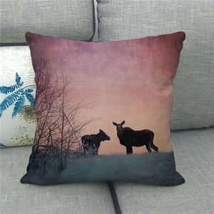 Detailed texture of linen cushion cover showing wildlife moose silhouette at sunset