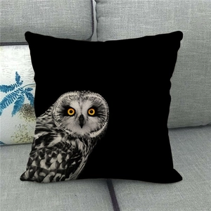 Detail of wild owl oil painting print on square linen pillowcase on grey sofa