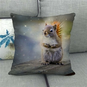 Detailed texture of square linen pillowcase with realistic squirrel print on a gray sofa