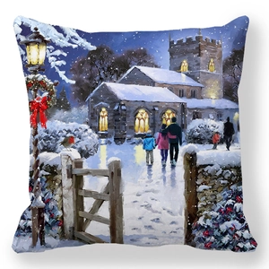 Detail of Christmas pillow cover featuring an oil painting of a winter church snow scene
