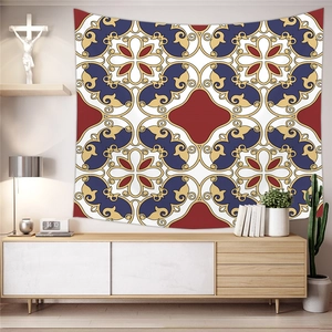 Detail of bohemian geometric tapestry hung above a wooden cabinet in a cozy living room