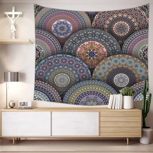 Bohemian mandala tapestry displayed over a modern sideboard in a cozy living room setting