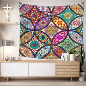 Bohemian mandala tapestry with vibrant floral patterns hanging in a modern living room