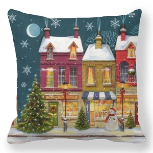 Detail of Christmas pillowcase showing snow-covered toy shop and festive town street