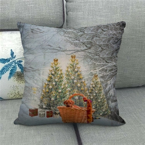Detailed view of linen Christmas pillowcase featuring dogs and snowy trees on grey sofa