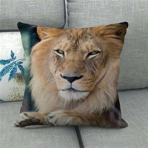 Linen decorative pillow cover featuring a realistic lion portrait on a gray sofa