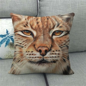Close-up of realistic lynx face printed on linen pillowcase against a grey sofa background