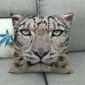 Detailed macro view of a snow leopard face printed on a soft linen square pillowcase