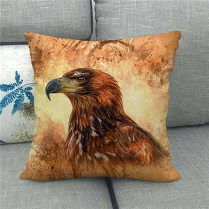 Close-up of a realistic eagle print linen pillowcase on a grey fabric sofa