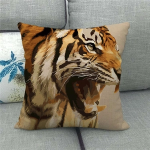 Wild tiger face print linen cushion cover on a grey sofa, realistic animal design