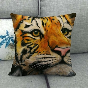 Detailed close-up of a square linen pillowcase with realistic tiger head print on a sofa