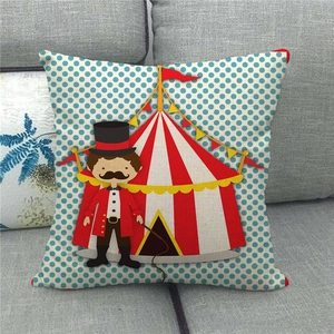 Close-up of linen cushion cover with cartoon circus tent and ringmaster pattern