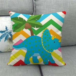 Detail of linen pillowcase with colorful chevron pattern and cute triceratops illustration