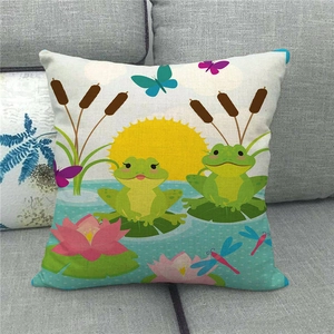 Detail of linen pillowcase with cute cartoon frogs, lotus flowers and pond scenery