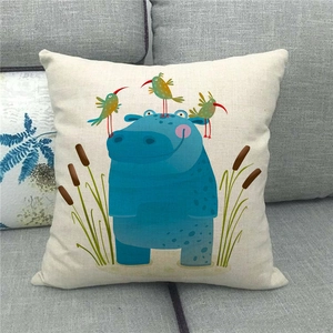 Square linen pillowcase with cute blue hippo cartoon illustration on a sofa