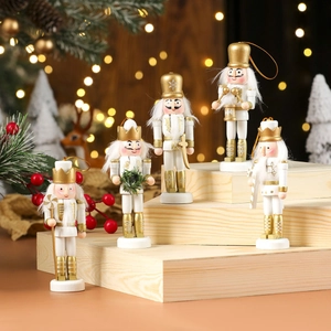 5-piece set of white and gold wooden Nutcracker Christmas ornaments on a wooden stand