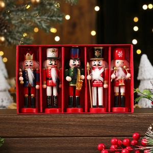 Five-piece wooden nutcracker soldier set in a red gift box with festive holiday decor