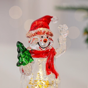 Figurine bonhomme de neige lumineux en verre avec chapeau rouge et feuille d'or décor