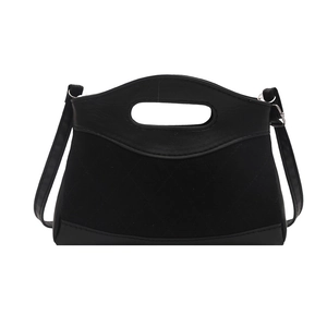 Black quilted crossbody bag with top handle and mixed leather texture on white background