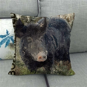 Close-up of wild boar print on textured linen pillowcase against a sofa background