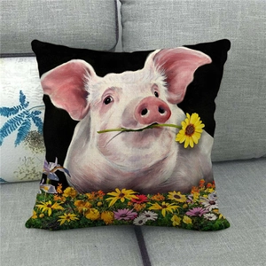 Detail of pink pig and colorful daisies floral pattern on linen decorative pillowcase