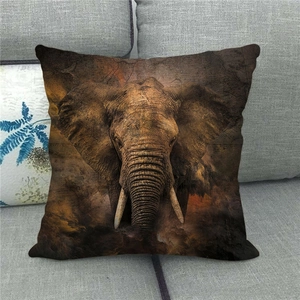 Linen pillowcase with African elephant portrait on grey sofa in vintage artistic style