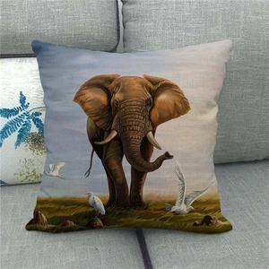 Detailed close-up of a linen pillowcase featuring a majestic elephant and heron pattern