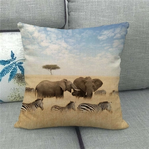 Macro detail of textured linen pillowcase featuring African elephant and zebra wildlife print
