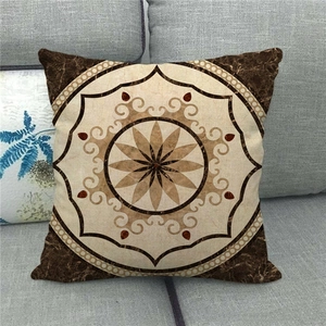 Detail of bohemian geometric mandala pattern on square linen throw pillow cover