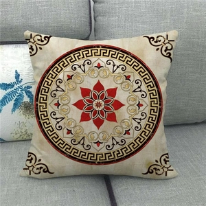 Detail of bohemian mandala pattern with red flower on beige linen decorative pillowcase