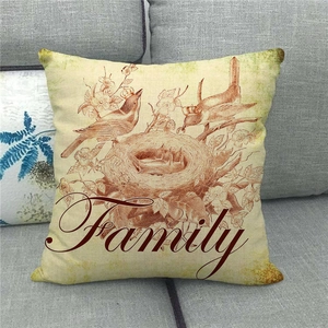 Detail of linen pillowcase featuring a hand-drawn bird nest and Family script text