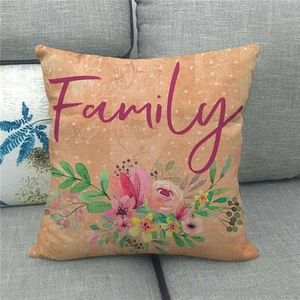Detailed fabric texture of a linen pillowcase featuring a floral wreath and Family text