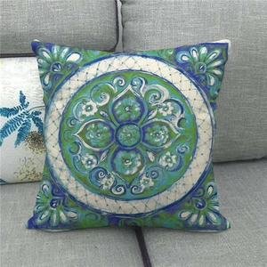 Detail showing the linen texture and mandala floral print on the square cushion cover