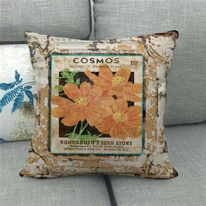 Close-up of vintage flower linen pillowcase with cosmos print and rustic seed store design